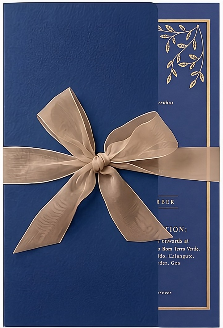 Closed wedding invitation card, tied with a ribbon
